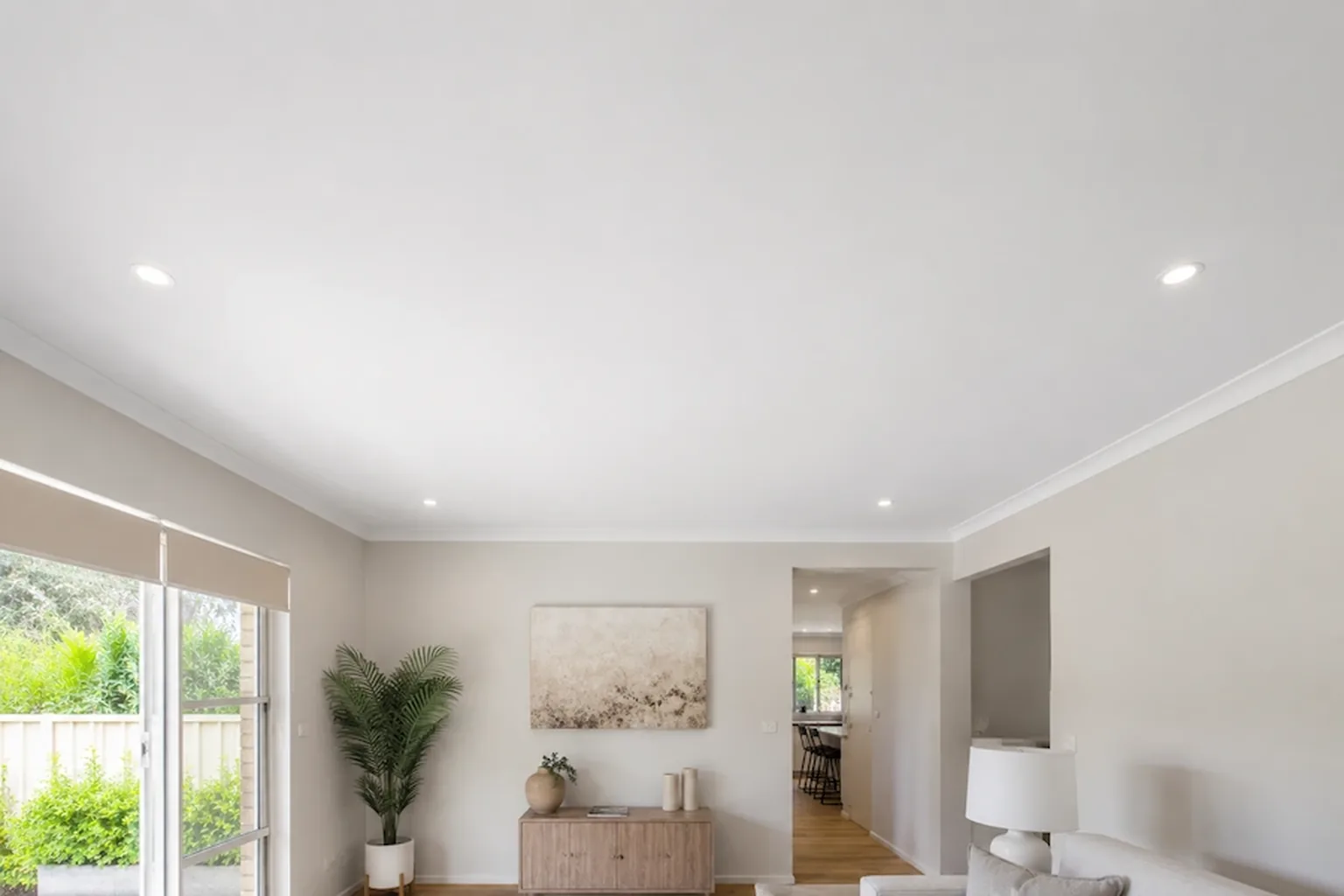 A new plasterboard ceiling finished flat and painted after replacement