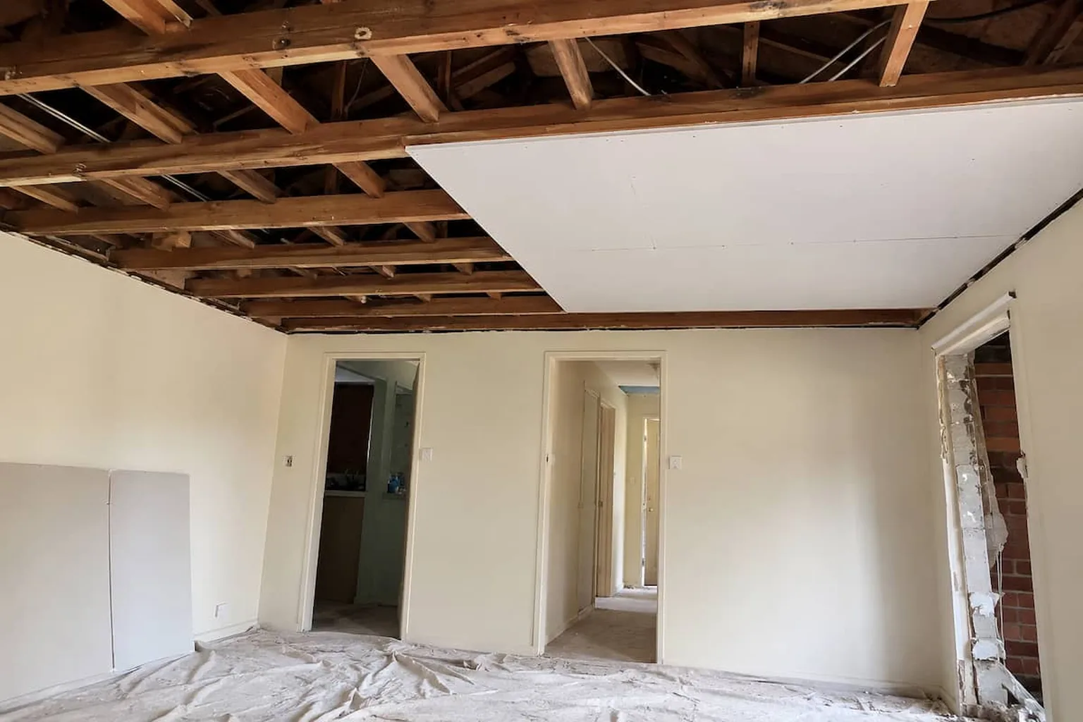 A room stripped back to bare timber joists ready for new gyprock to go up