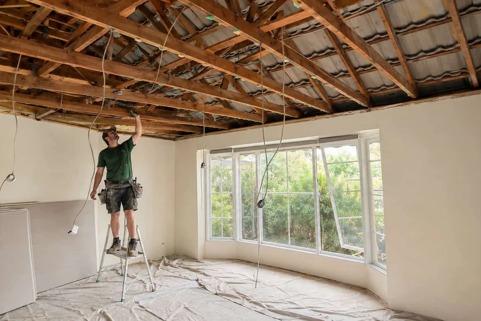 A Perth ceiling stripped out and being replaced, with the room cleared and drop sheets down