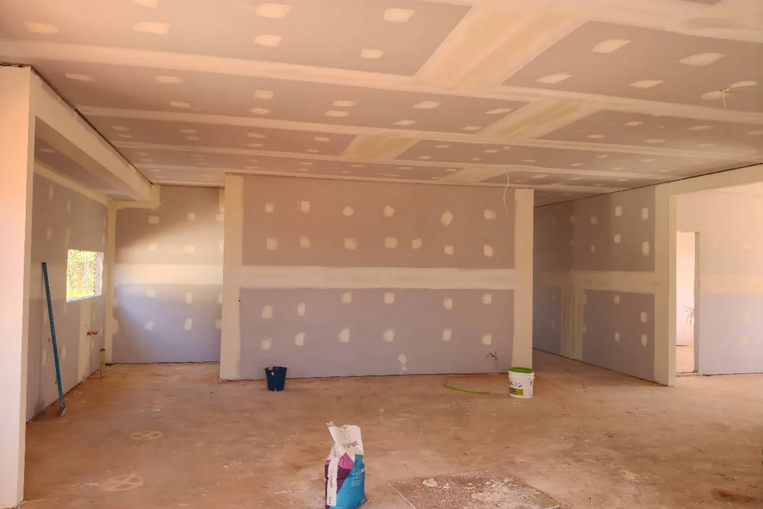 A full ceiling replacement under way with the old sheets out and the framing exposed
